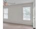 Bright bedroom with two windows offering natural light and neutral carpet flooring at 5009 Kingsley Manor Ct, Marietta, GA 30066
