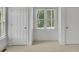 Bright bedroom with carpet flooring and two closets at 5009 Kingsley Manor Ct, Marietta, GA 30066
