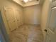 A compact bedroom with tiled floor, ceiling fan, and access to two closets at 5009 Kingsley Manor Ct, Marietta, GA 30066