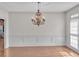 Formal dining room with chandelier, crown molding, and natural light from windows at 5009 Kingsley Manor Ct, Marietta, GA 30066