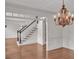 Foyer with a view of the staircase, chandelier, and dining room at 5009 Kingsley Manor Ct, Marietta, GA 30066