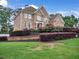 Charming two-story brick home with a beautifully landscaped front yard at 5009 Kingsley Manor Ct, Marietta, GA 30066
