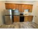 Kitchen featuring a stainless steel refrigerator and wood cabinets at 5009 Kingsley Manor Ct, Marietta, GA 30066