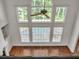 Bright living room with hardwood floors, a ceiling fan, and many windows at 5009 Kingsley Manor Ct, Marietta, GA 30066