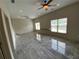 Living room featuring two ceiling fans and nice tile floors at 5009 Kingsley Manor Ct, Marietta, GA 30066