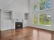 Bright living room featuring a fireplace, hardwood floors, and large windows with a view at 5009 Kingsley Manor Ct, Marietta, GA 30066