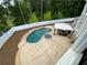 A newly installed in-ground pool and hot tub surrounded by a stamped concrete patio with outdoor seating at 5009 Kingsley Manor Ct, Marietta, GA 30066