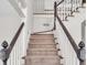 Carpeted stairway with white railing and wood trim at 5009 Kingsley Manor Ct, Marietta, GA 30066