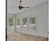 The sun room features tile floors and multiple windows providing tons of natural light at 5009 Kingsley Manor Ct, Marietta, GA 30066