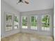 The sun room features tile floors and multiple windows providing tons of natural light at 5009 Kingsley Manor Ct, Marietta, GA 30066