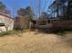 Cozy home featuring a spacious backyard with mature trees, offering a private and serene outdoor space at 2807 Mcclave Dr, Doraville, GA 30340