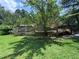 Backyard features a wooden deck, partial fence, and lush green lawn at 2807 Mcclave Dr, Doraville, GA 30340