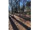 Secluded backyard showcasing mature trees, sunlight and ample space for outdoor activities at 2807 Mcclave Dr, Doraville, GA 30340
