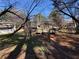 View of backyard deck, mature trees, and landscaping at 2807 Mcclave Dr, Doraville, GA 30340