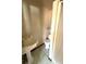 Bathroom with pedestal sink and tiled floors at 2807 Mcclave Dr, Doraville, GA 30340