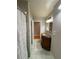 Bathroom boasts unique vanity with golden sink and tiled floors at 2807 Mcclave Dr, Doraville, GA 30340