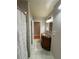 Bathroom boasts unique vanity with golden sink and tiled floors at 2807 Mcclave Dr, Doraville, GA 30340