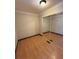 Bedroom with hardwood floors and mirrored closet at 2807 Mcclave Dr, Doraville, GA 30340