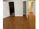 Bedroom featuring hardwood floors, closet, and bathroom access at 2807 Mcclave Dr, Doraville, GA 30340