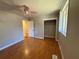 Cozy bedroom features a ceiling fan, closet, and wood floors at 2807 Mcclave Dr, Doraville, GA 30340