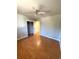 Cozy bedroom with ceiling fan, neutral paint, and hardwood floors at 2807 Mcclave Dr, Doraville, GA 30340