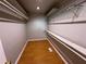 Walk-in closet with shelving and hardwood floors at 2807 Mcclave Dr, Doraville, GA 30340