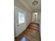 Home entryway with decorative glass door, hardwood floors, and stairs leading up at 2807 Mcclave Dr, Doraville, GA 30340