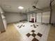 Spacious garage with pegboard, shelving, tile flooring and two doors at 2807 Mcclave Dr, Doraville, GA 30340
