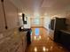 Spacious kitchen and dining area offer modern appliances, granite counters, and hardwood floors at 2807 Mcclave Dr, Doraville, GA 30340
