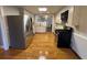 Updated kitchen with stainless steel appliances and wood-look floors at 2807 Mcclave Dr, Doraville, GA 30340