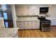 Well-lit kitchen featuring tile countertops and stainless steel oven at 2807 Mcclave Dr, Doraville, GA 30340