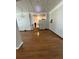 Spacious living room featuring hardwood floors, chandelier lighting, and an open staircase at 2807 Mcclave Dr, Doraville, GA 30340