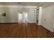 Living room features hardwood floors, built-in shelving, and sliding glass doors to the outside at 2807 Mcclave Dr, Doraville, GA 30340