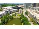 An aerial view captures a monument within a meticulously landscaped park next to a tranquil pond at 400 17Th Street Nw # 2313, Atlanta, GA 30363