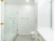 Bright bathroom with double vanity, glass shower, and wood-look tile floors at 400 17Th Street Nw # 2313, Atlanta, GA 30363