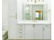Modern bathroom featuring double vanity with gold hardware and large mirror at 400 17Th Street Nw # 2313, Atlanta, GA 30363