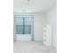 Minimal bedroom featuring neutral carpet, built-in shelving and a large window at 400 17Th Street Nw # 2313, Atlanta, GA 30363