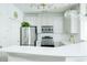 Bright kitchen featuring stainless steel appliances, pendant lighting, and white cabinets at 400 17Th Street Nw # 2313, Atlanta, GA 30363