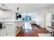 Bright living room features hardwood floors, a breakfast bar, and large windows at 400 17Th Street Nw # 2313, Atlanta, GA 30363