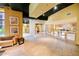 Spacious lobby area featuring tiled floors, black ceiling, and bar with stools at 400 17Th Street Nw # 2313, Atlanta, GA 30363