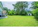 Spacious backyard with grass, shed, and greenery at 4732 Manly Ct, Stone Mountain, GA 30088