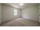 Bright bedroom with carpet, window, and closet at 4732 Manly Ct, Stone Mountain, GA 30088