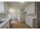 Spacious kitchen with stainless appliances, a dining area, and updated cabinetry and countertops at 4732 Manly Ct, Stone Mountain, GA 30088