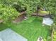 Aerial view of the backyard featuring a large grassy lawn and storage shed at 1292 Eubanks Ave, East Point, GA 30344