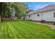 The wide, level back yard is freshly mowed and ready for play at 1292 Eubanks Ave, East Point, GA 30344