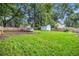 Large, grassy backyard featuring a storage shed and wood privacy fence at 1292 Eubanks Ave, East Point, GA 30344