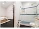 Bathroom featuring a tiled shower, toilet and access to main bedroom at 1292 Eubanks Ave, East Point, GA 30344
