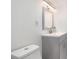 Updated bathroom with a modern vanity, mirror and sink, plus a toilet at 1292 Eubanks Ave, East Point, GA 30344