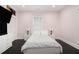 This bright bedroom features a large TV, built-in wardrobe, and two windows at 1292 Eubanks Ave, East Point, GA 30344