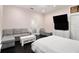 This is an alternate view of the bedroom showcasing a sitting area with grey sofa at 1292 Eubanks Ave, East Point, GA 30344
